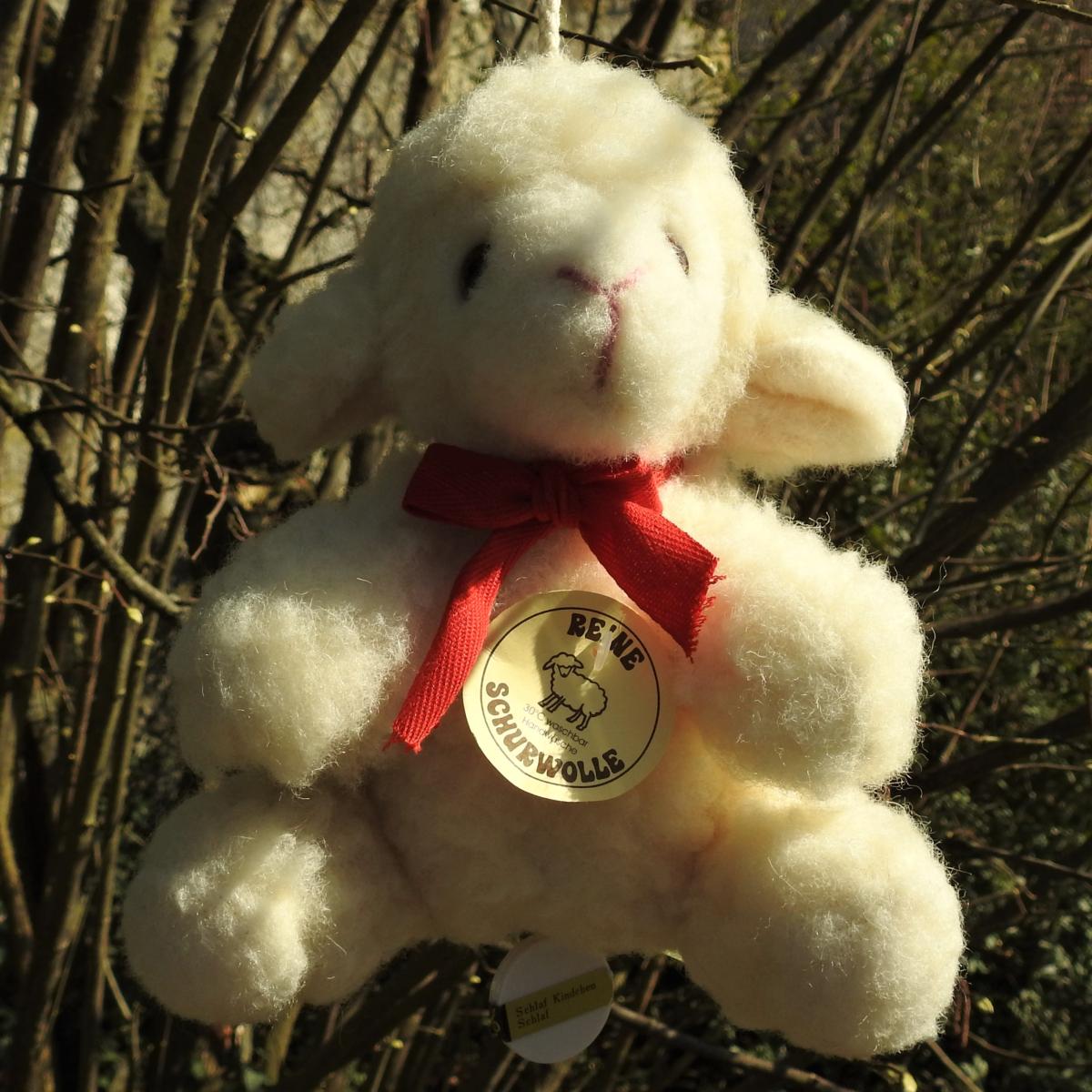 Schafwoll Kuscheltier Lamm mit Spieluhr Schafwoll Kuscheltier Lamm mit Spieluhr