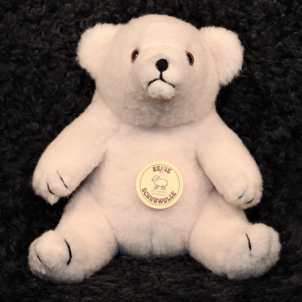 Schafwoll Kuscheltier Eisbär sitzend Schafwoll Kuscheltier Eisbär sitzend
