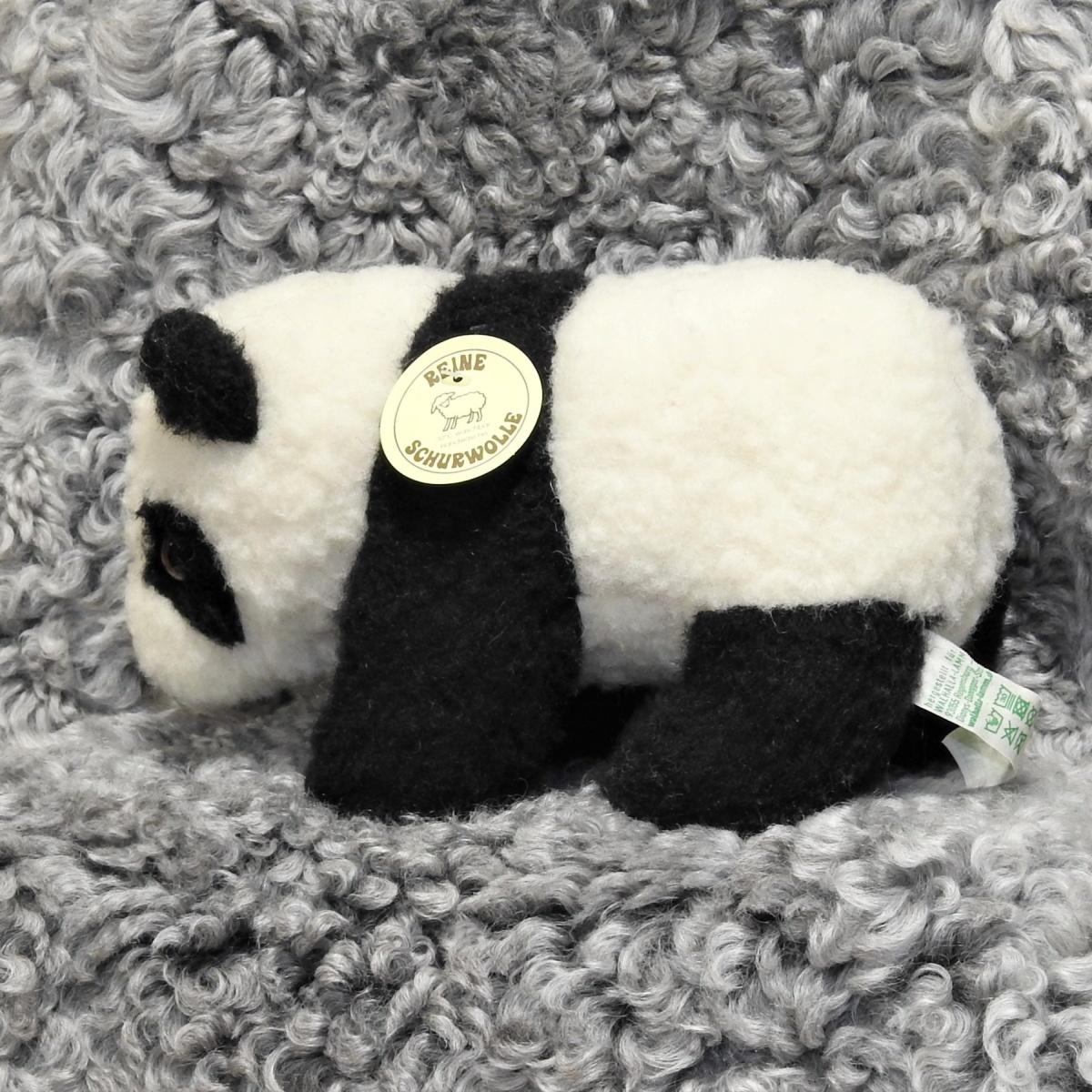 Schafwoll-Kuscheltier Pandabär